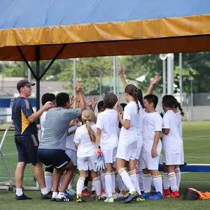 Team huddle in the shade before kick-off