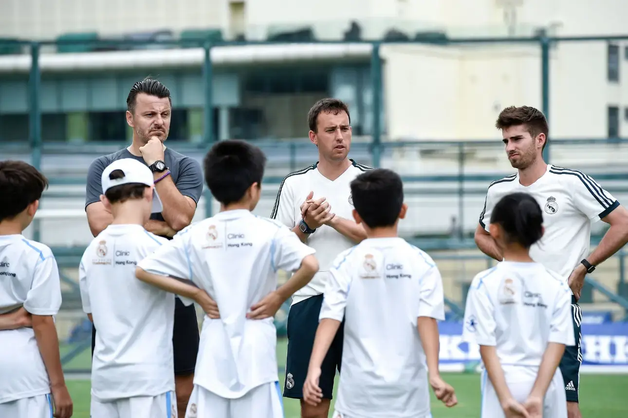 Real Madrid Foundation coaches with players