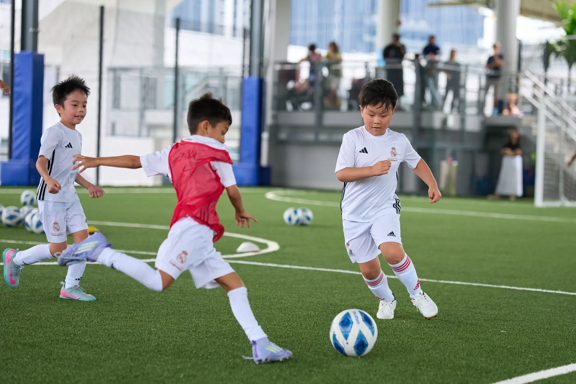 Young football players training with a coach
